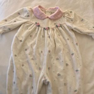 Velour onesie with pink satin collar and satin rose detail.